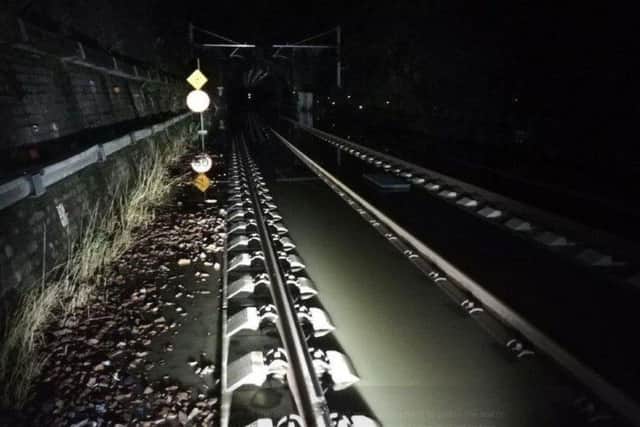 Flooded tracks near Linlithgow suspended trains between Edinburgh and Glasgow. Picture; ScotRail