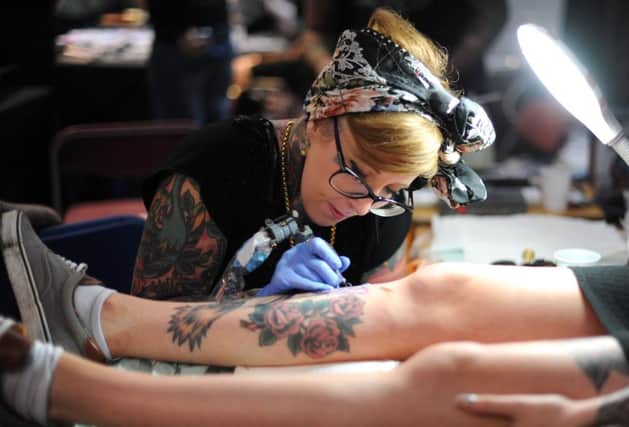 The most popular tattoos of 2019 include minimalist, fine line, small and hand tattoos but employers are within their rights to have a policy banning tattoos. Picture: Jane Barlow