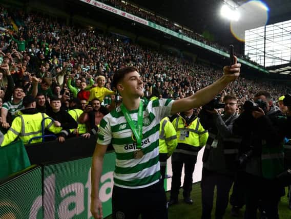 Kieran Tierney takes a selfie with the Celtic fans