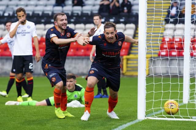 Peter Pawlett starts celebrating after scoring the winner for Dundee United against Partick Thistle. Picture: Bruce White/SNS