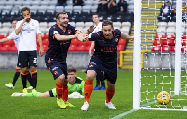 Peter Pawlett starts celebrating after scoring the winner for Dundee United against Partick Thistle. Picture: Bruce White/SNS
