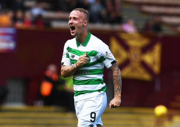 Leigh Griffiths celebrates making it 2-1 to Celtic at Fir Park. Picture: Craig Foy/SNS.