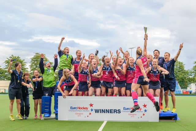 Trophy time: Kaz Cuthbert hoists the cup aloft as her teammates celebrate at Glasgow Green. Photograph: Duncan Gray