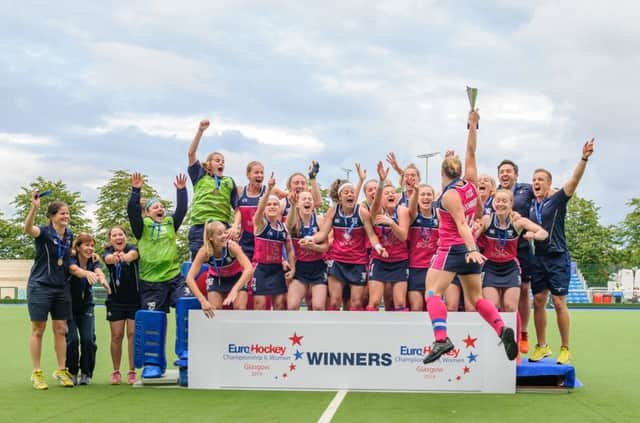 Trophy time: Kaz Cuthbert hoists the cup aloft as her teammates celebrate at Glasgow Green.  Photograph: Duncan Gray