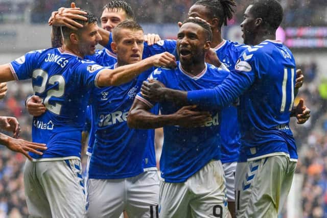 Jermain Defoe takes the acclaim of his team-mates after netting against Hibs