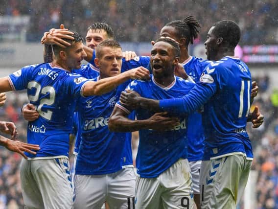 Jermain Defoe takes the acclaim of his team-mates after netting against Hibs