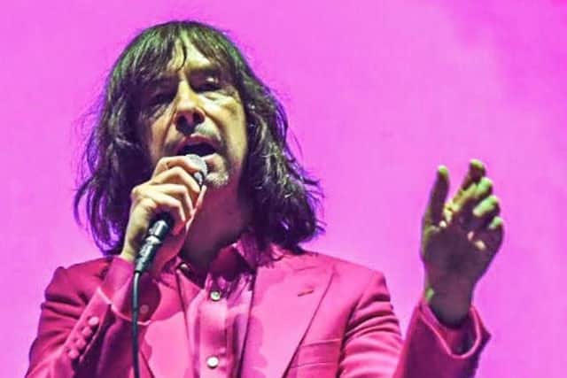 Bobby Gillespie wore a bright pink suit.