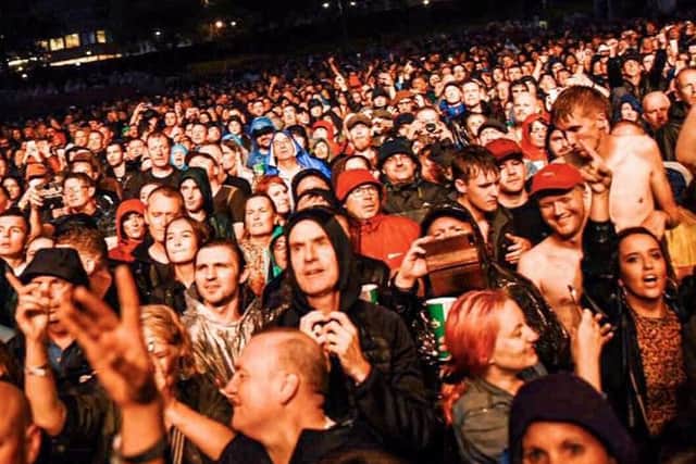 The torrential rain didn't deter the crowd.