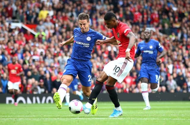 Marcus Rashford holds off Chelsea defender Cesar Azpilicueta to fire home Manchester United's third goal. Picture: Julian Finney/Getty
