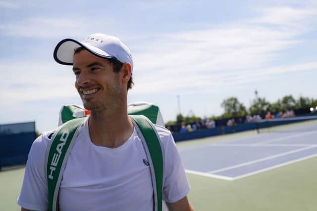 Andy Murray is all smiles after practice at the Western & Southern Open in Cincinnati. Picture: John Minchillo/AP