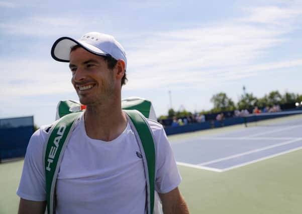 Andy Murray is all smiles after practice at the Western & Southern Open in Cincinnati. Picture: John Minchillo/AP