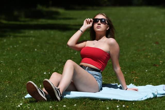 We may enjoy the need to apply sun cream or swim in the North Sea, but the increased temperatures are a sign of climate-related change  and a wake-up call to do something about it. Picture: John Devlin