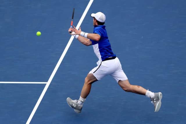 Andy Murray returns a shot to Richard Gasquet during his 6-4, 6-4 defeat by the Frenchman in the first round last night. Picture: Getty.