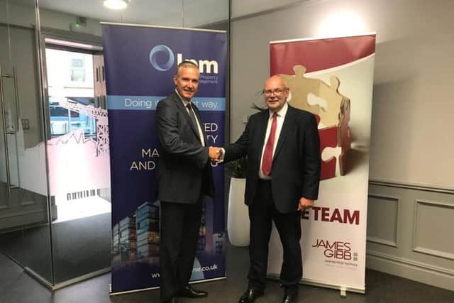 David Reid and Douglas Weir shakes hands on the deal. Picture: Contributed