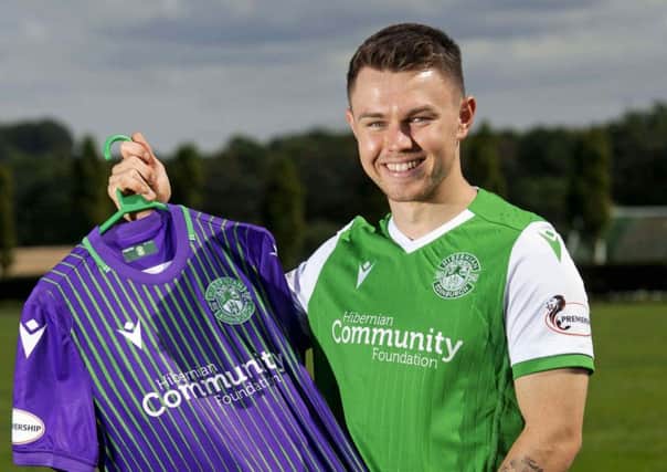 Glenn Middleton is unveiled by Hibs after his protracted loan move was finally concluded. PictureL SNS.