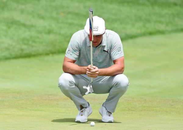 Bryson DeChambeau has been criticised for the times he takes to line up a putt. Picture: Jared C. Tilton/Getty Images