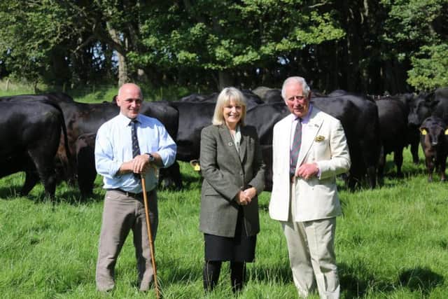 Farmer Danny McCarthy and Judith Batchelar with the Duke of Rothesay at Castle of Mey. Picture: Peter Jolly