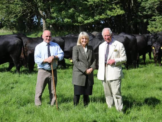 Farmer Danny McCarthy and Judith Batchelar with the Duke of Rothesay at Castle of Mey. Picture: Peter Jolly