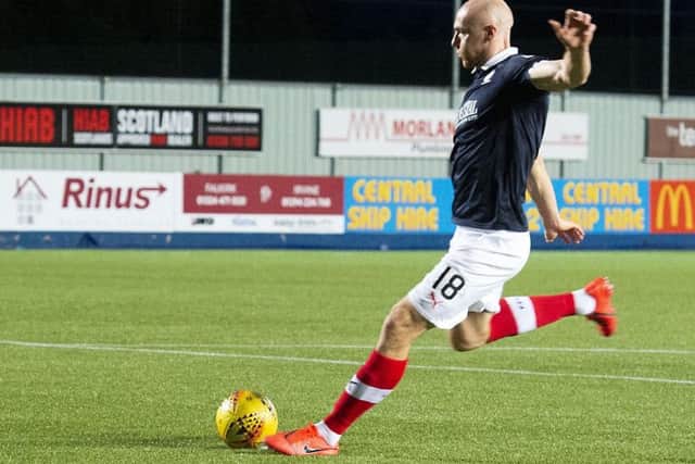 Conor Sammon converts for Falkirk against Celtic U21 in the penalty shoot-out. Picture: SNS