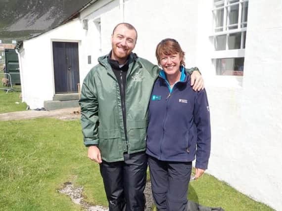 Singer Sam Smith with NTS ranger Sue Loughran on St Kilda yesterday. PIC: Contributed.