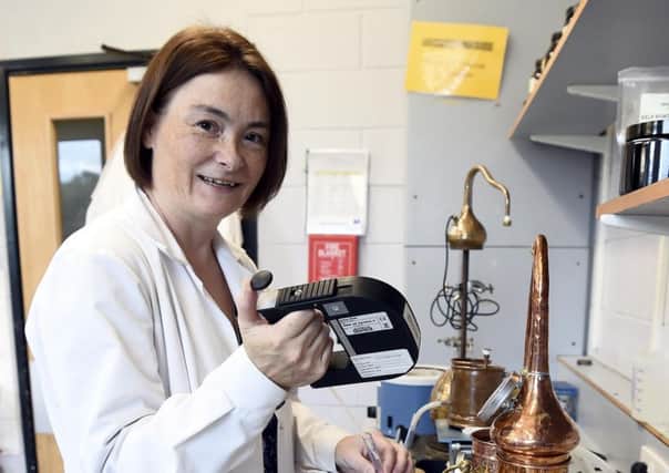 Dr Annie Hill, associate professor of Brewing and Distilling at Heriot-Watt University, takes some necessary measures. Picture: Lisa Ferguson