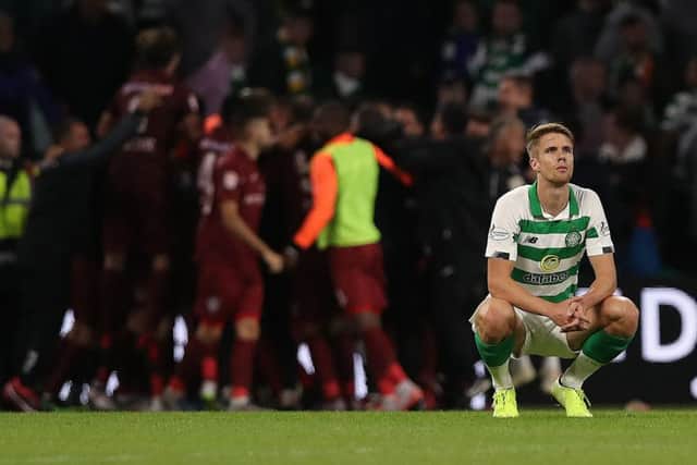 Kristoffer Ajer cuts a dejected figure as he contemplates Celtics shock exit from the Champions League at the hands of Cluj at Celtic Park.