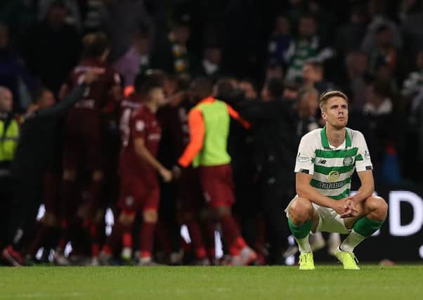 Kristoffer Ajer cuts a dejected figure as he contemplates Celtics shock exit from the Champions League at the hands of Cluj at Celtic Park.