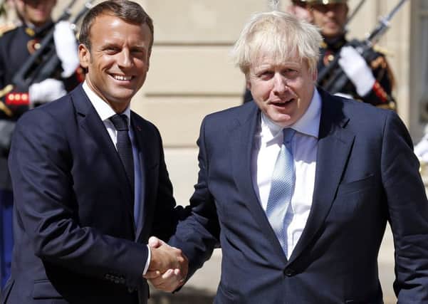 Emmanuel Macron welcomes r Boris Johnson to the Elysee Presidential Palace. Picture: Getty