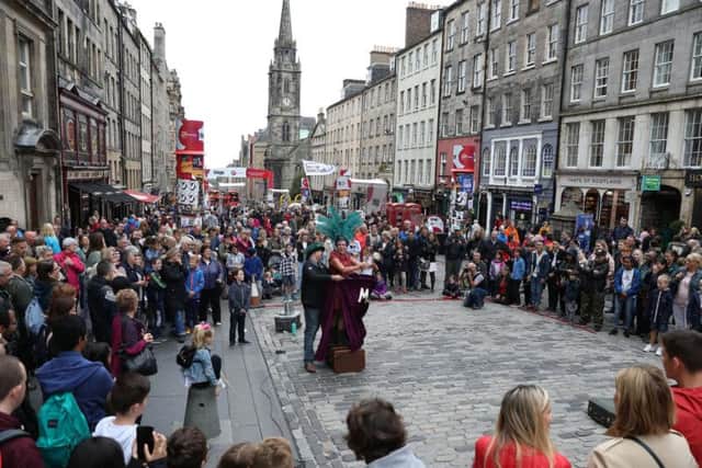 Fringe-goers taking in a street show. Picture: Contributed.