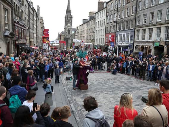 Fringe-goers taking in a street show. Picture: Contributed.