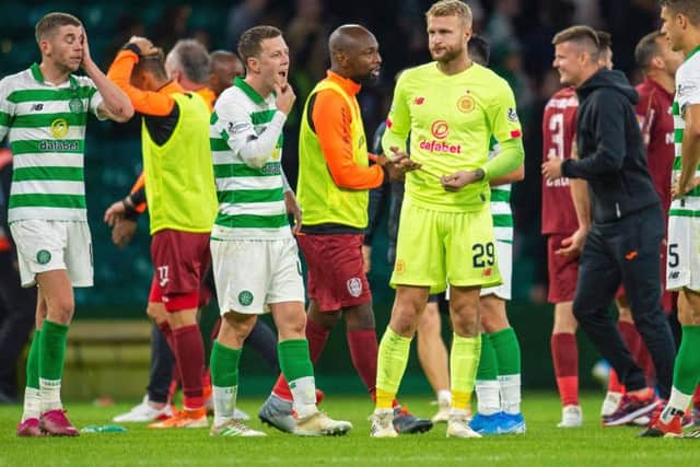 Scott Bain (centre right), Callum McGregor and Ryan Christie look dejected after the final whistle against Cluj
