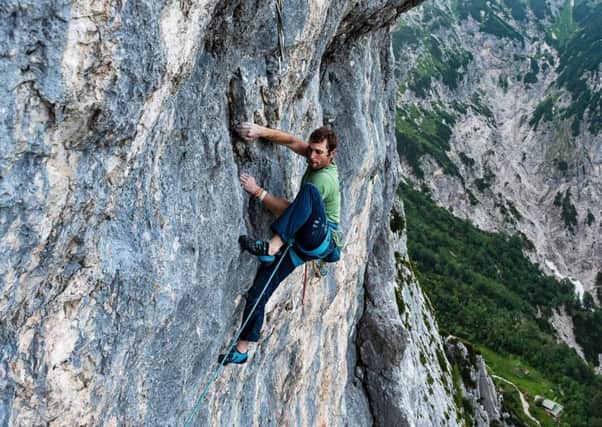 Scottish climber Robbie Phillips, 29, has become the first Briton to finish the Alpine Trilogy
