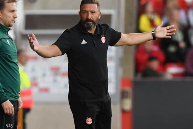 Derek McInnes questions a decision by the referee