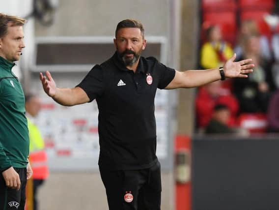 Derek McInnes questions a decision by the referee