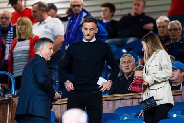 Andy King takes in the Rangers game prior to joining from Leicester on a season-long loan