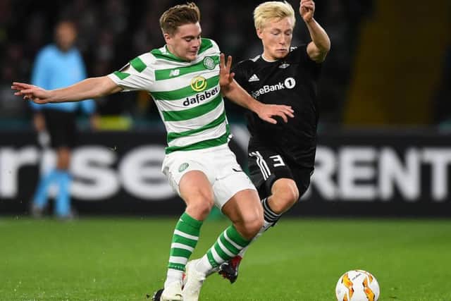 Birger Meling (right) battles for the ball with Celtic's James Forrest
