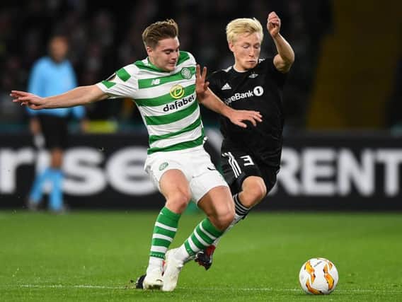 Birger Meling (right) battles for the ball with Celtic's James Forrest
