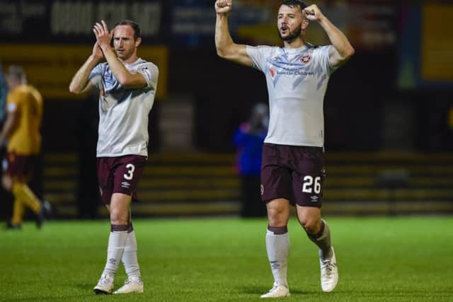 Hearts' Craig Halkett, right, and Aidy White celebrate at full-time. Picture: Rob Casey/SNS