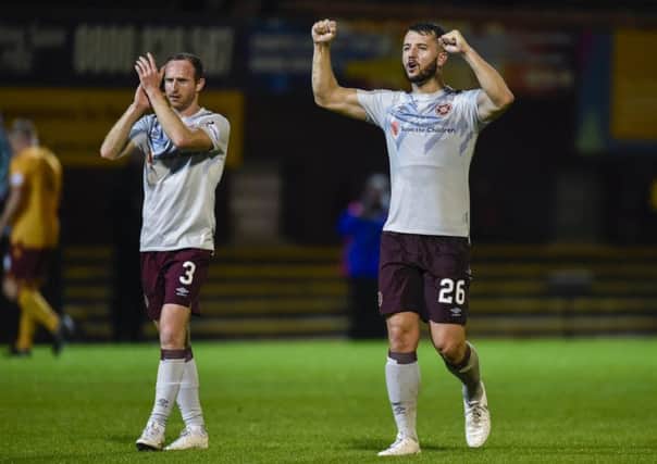 Hearts' Craig Halkett, right, and Aidy White celebrate at full-time. Picture: Rob Casey/SNS