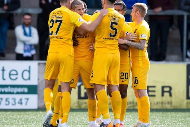 Livingston players celebrate.