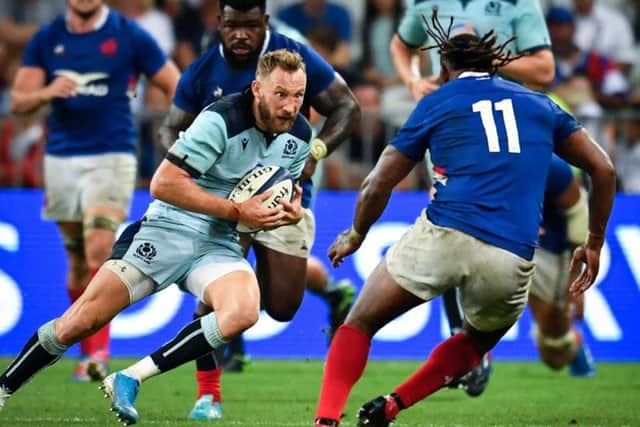 Sotland winger Byron McGuigan comes up against France debutant Alivereti Raka. Picture: Pascal Guyot/AFP/Getty Images