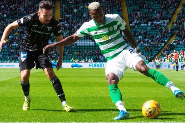 Celtic's Boli Bolingoli shields the ball from Ryan Dow of Dunfermline. Picture: SNS