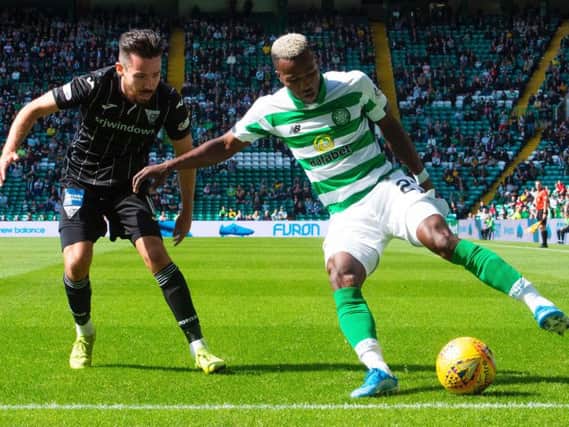 Celtic's Boli Bolingoli shields the ball from Ryan Dow of Dunfermline. Picture: SNS