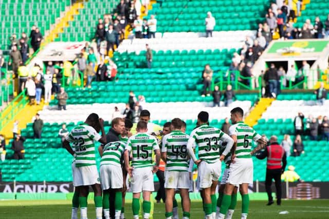 Neil Lennon talks to his Celtic players after the 2-1 extra-time win over Dunfermline Athletic.