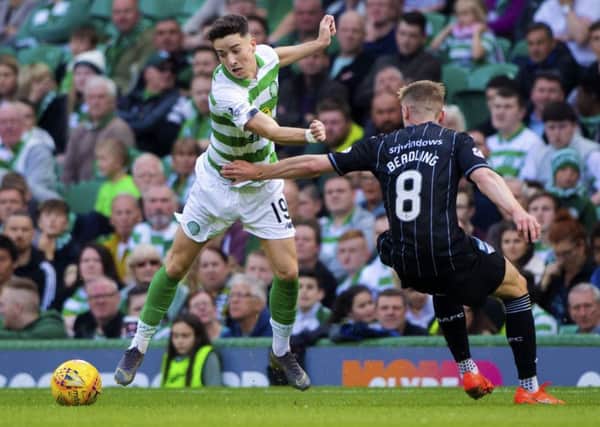 Celtic's Mikey Johnston in action against Dunfermline's Tom Beadling. Picture: Bill Murray/SNS