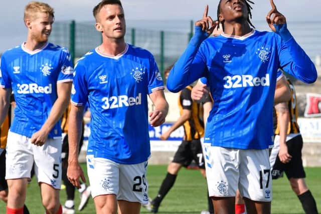 Joe Aribo celebrates after netting Rangers' third goal.