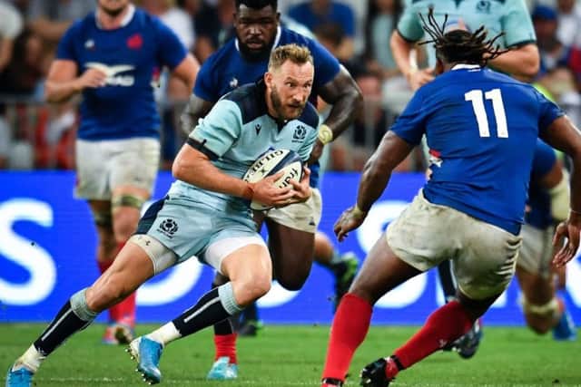 Scotland's Byron McGuigan faces up to French wing Alivereti Raka during the World Cup warm-up defeat in Nice. Picture: Pascal Guyot/AFP