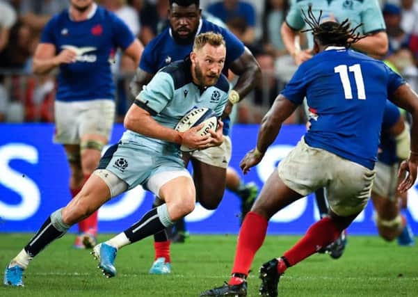Scotland's Byron McGuigan faces up to French wing Alivereti Raka during the World Cup warm-up defeat in Nice. Picture: Pascal Guyot/AFP