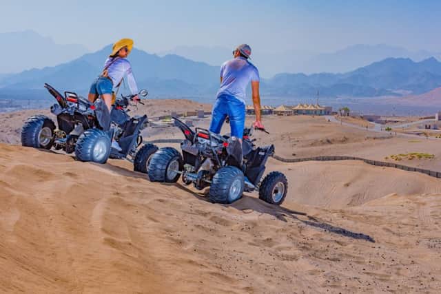 Exploring the Wadi Al Abiyad sand dunes by quad bike is one of the activities on offer at Dunes by Al Nahda Resort, Oman