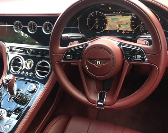 The interior is a shimmer of chromed buttons and switches